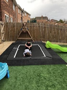 Rubber Play Tiles Used Around A Built In Garden Trampoline