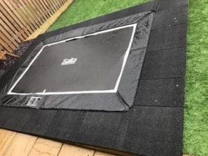 Rubber Play Tiles Used Around A Built In Garden Trampoline: The Work