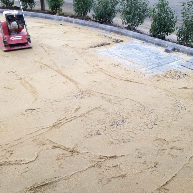 Compacting X-Grid & Laying Artificial Grass
