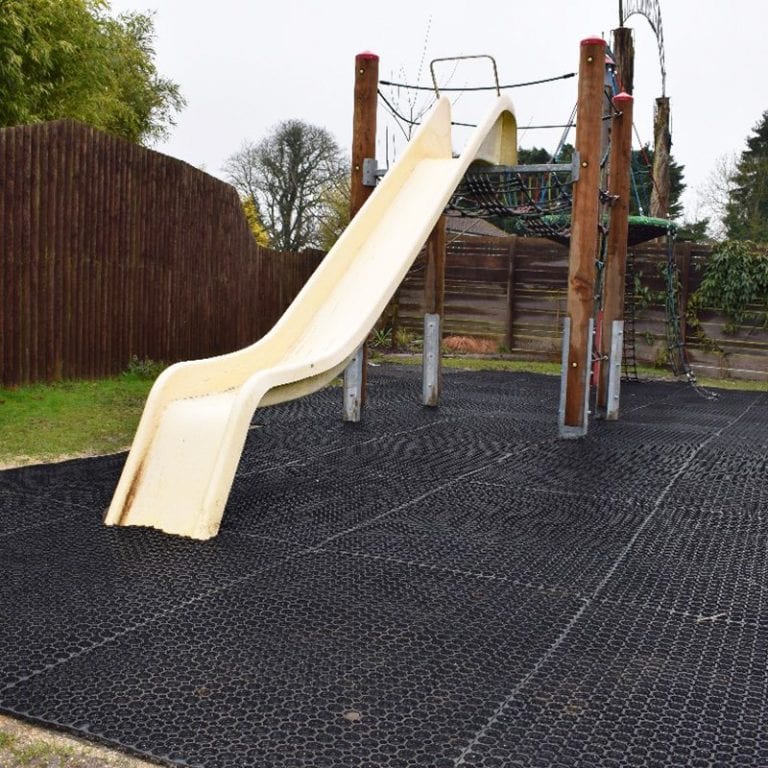 Using Rubber Grass Mats Under A Play Area: Work