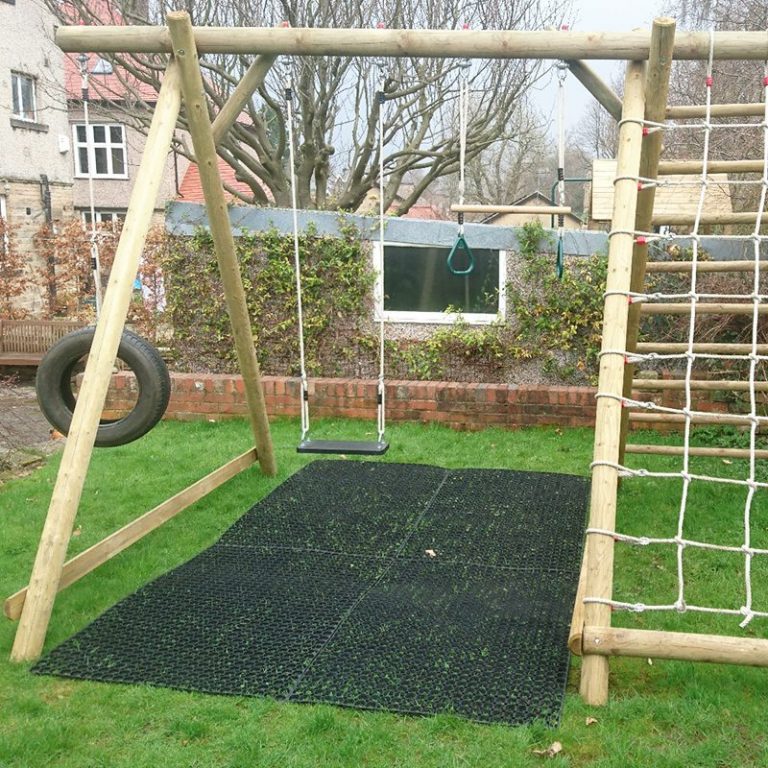 Rubber Grass Mats Installed Under A Caledonia Play Swing Set: Work