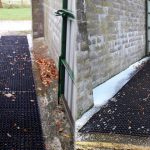Grass Mats Used To Create A Non-Slip Path Over Concrete For Ponies - Featured Image