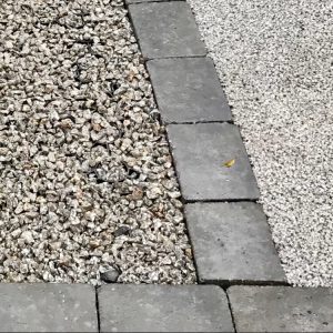 Plastic paving grid filled with gravel